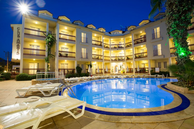 Large sunny pool in Mediterranean Garden setting